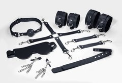 Набор для БДСМ 7в1: наручники, поножи, коннектор, маска, паддл, кляп, зажимы Feral Feelings BDSM Kit 7 Black, черный картинка